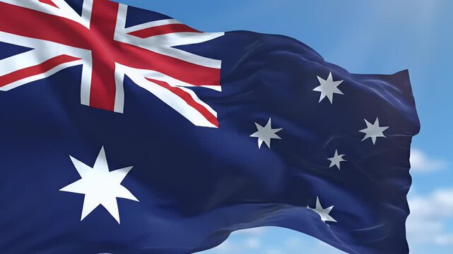 A close-up shot of a dark blue flag with white stars and a red, white, and blue union jack
