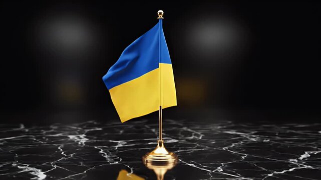 A small national flag on a golden stand sits on a black marble surface