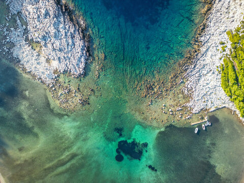 Aerial top-down abstract view of white limestone coastline and turquoise sea, Mljet Island, Dalmatian Coast, Croatia