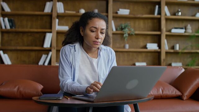 Woman Feeling Chest Discomfort at Laptop