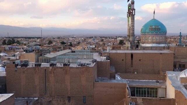 Stunning Aerial view of Kashan city skyline and blue domed mosque in Iran. Historic City and architectural design 