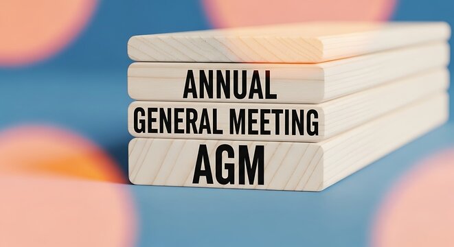 Annual General Meeting AGM Text on Wooden Blocks Business Concept.