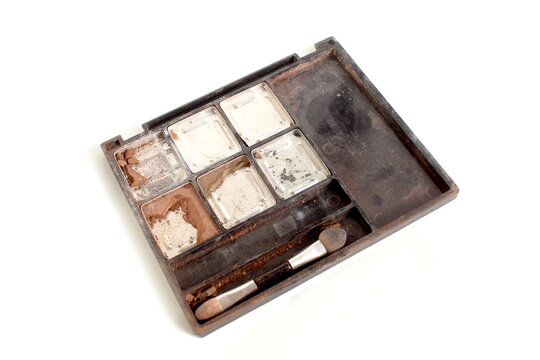 Old eyeshadows lie on a white background.