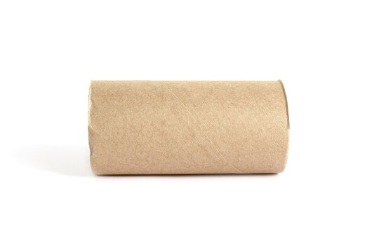 There is a cardboard toilet paper roll lying on a white background.
