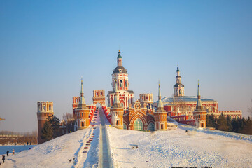 The bright red structure contrasts beautifully with the blue sky at Volga manor, Harbin, China.