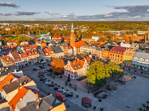 The market square in Starogard Gdanski in the light of the setting sun at autumn. Poland