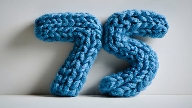 Blue knitted number seventy-five on white background