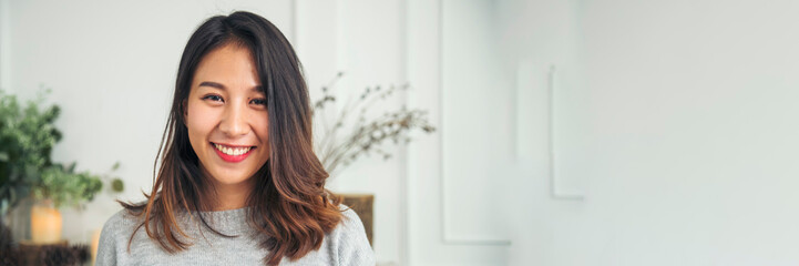 Naklejka premium Banner Portrait Asian women happiness smiling laugh happy person look at camera. Banner Beautiful happy girl portrait joy cheerful. Confidence females candid shot woman smile face with copy space