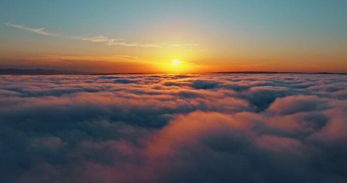 Soaring over thick clouds blanket bright sun flare high altitude drone flight. Atmospheric heaven landscape sunset morning. Success motivation future vision inspiration concept aerial view.