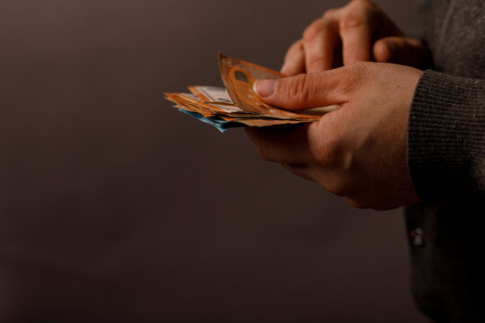 Close-up of hands counting euro banknotes, financial concept, money, wealth, economics, cash, financ