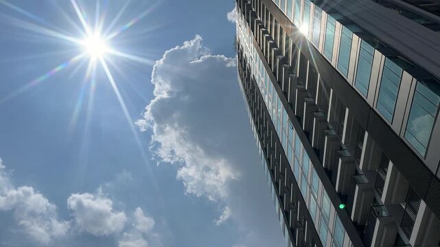 Hot Summer Sun Over Modern Skyscraper and Blue Sky, weather global warning, climate change