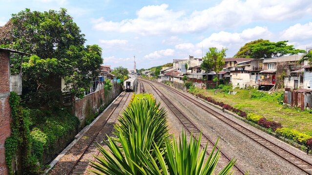 Scenic train tracks through urban landscape. East Java, Malang - September 6, 2025 (2)