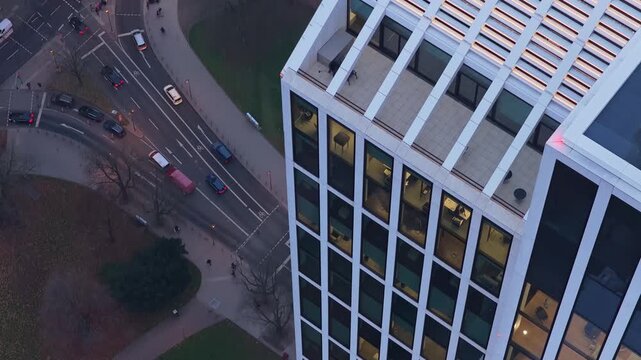 High angle view of TaunusTurm modern skyscraper in Frankfurt financial district. City traffic flowing on the streets below during the evening