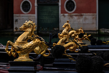 Close-up of Venetian gondola details, showcasing traditional craftsmanship and decorative elements in Venice, Italy. © Yuliya Ihnatkovich