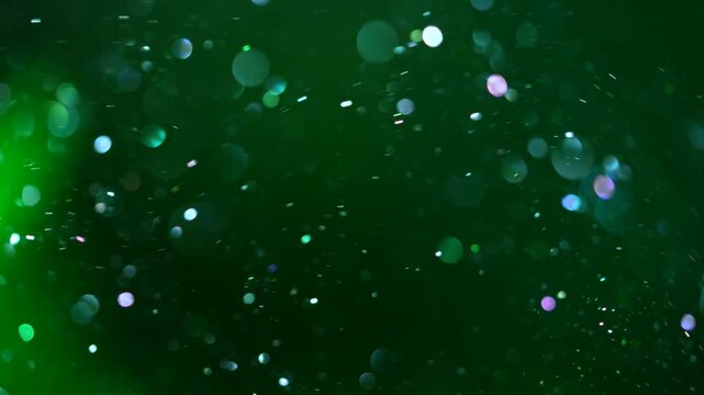 Soft blurred blue bokeh lights and sparkle float against a gradient red background. Concept for overlay, holiday, events industries, beauty and cosmetics, branding, digital design, advertising and