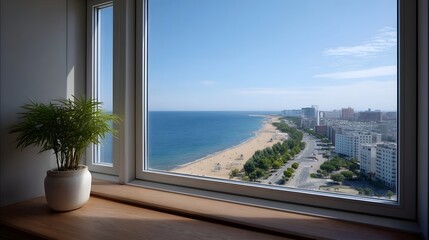 Fototapeta premium View from high window over sunny beach blue ocean and urban cityscape with buildings