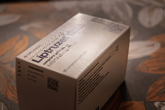 PARIS, FRANCE - MARCH 4, 2026: Close view of a Liptruzet pill box by Organon resting on a table in France, it's a cholesterol-lowering medication combining ezetimibe and atorvastatin.