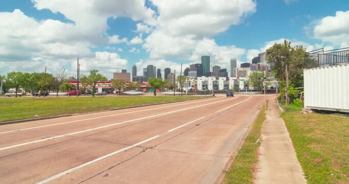 Timelapse lapse of of cloudy sky over downtown Houston surrounding urban landscape
