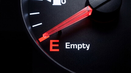 Naklejka premium Fuel gauge showing empty tank. Car dashboard needle indicating low gasoline level. Rising energy cost and gas shortage crisis. Transportation economy and vehicle maintenance concept.