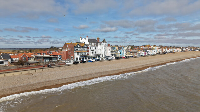 Aerial view of the Aldeburgh coastline where the muted hues of the sea meet the varied architecture, a picturesque scene of England's charm, Aldeburgh, England, United Kingdom.