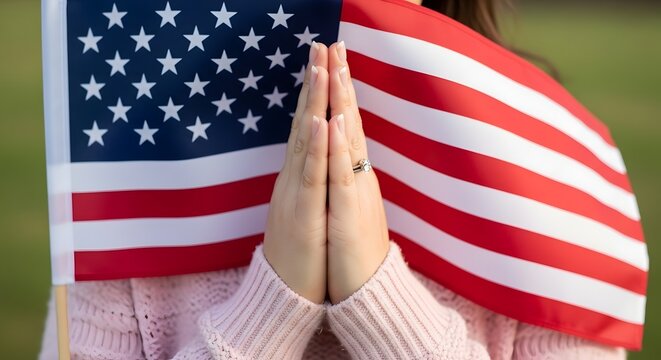 Patriotic prayer hands in front of american flag