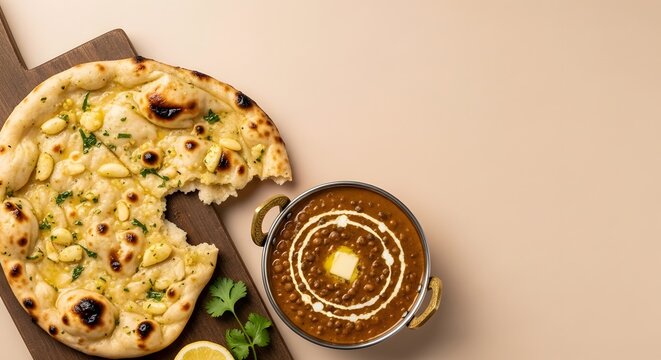 Traditional black lentil dal makhani paired with soft garlic naan
