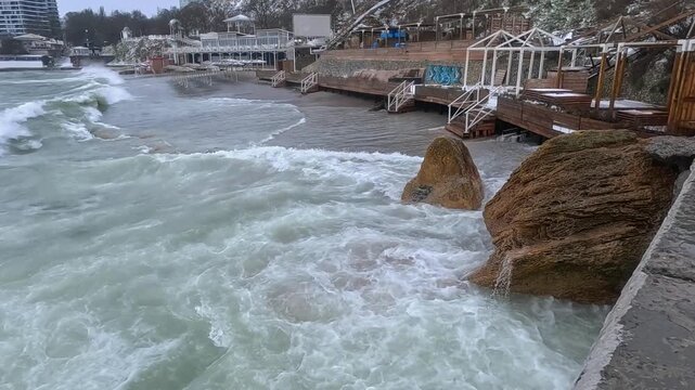 Odessa, Ukraine - February 05, 2026: Storm in the Black Sea, waves eroded the beach, Odessa