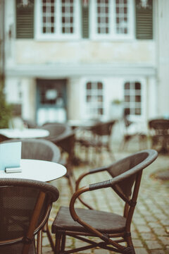 Close-up of wicker chairs and tables with checked tablecloths outside a restaurant, Luxembourg