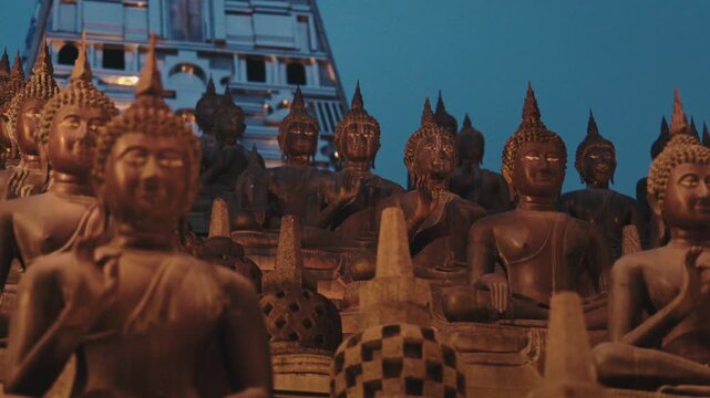 Row of Golden Buddha Statues in Colombo Sri Lanka Temple