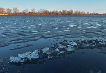 A natural background of a river with melted ice floes on the water © martina87