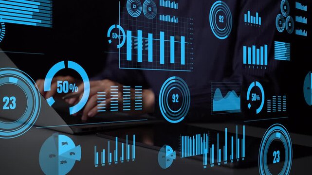 A close-up view of a professional analyzing business data through digital graphs and charts on a screen, highlighting technology and analytical skills in a modern workspace. Xenic