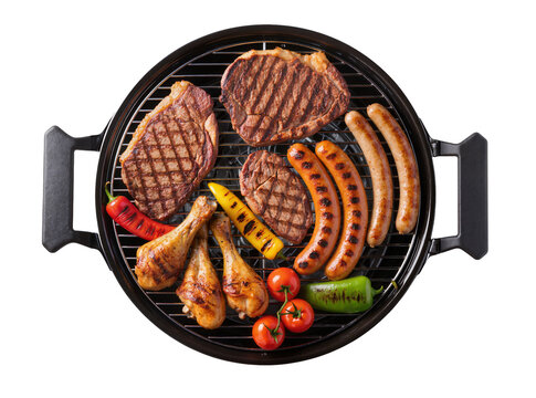 Isolated delicious grilled meat and vegetables assortment on a portable barbecue grill for summer cookout