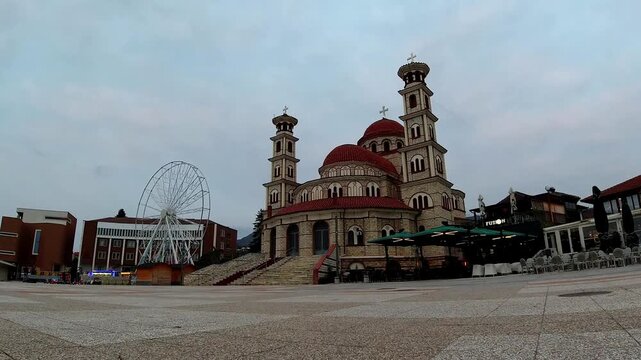 Kor&ccedil;&euml;, Albania - March 24, 2026: A blue hour time-lapse captures the Resurrection of Christ Cathedral with a diagonal tracking motion as the city transitions from twilight to evening.