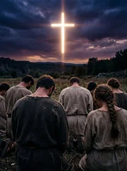 Kneeling figures before glowing cross at dusk © misu