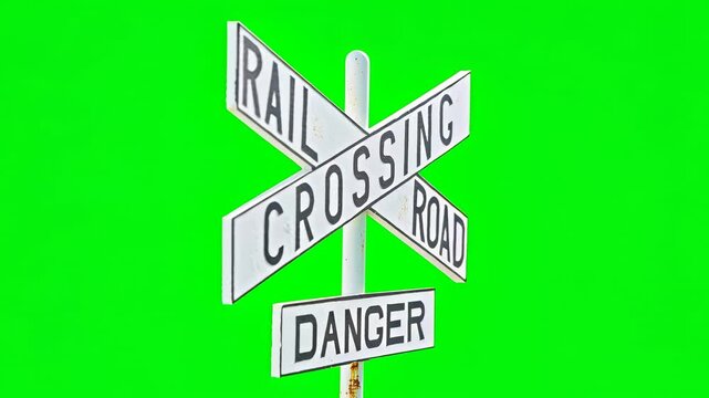 Railroad Crossing Danger Warning Sign Isolated on Green Screen for Chroma Key.