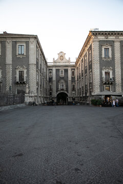 View of the historic Baroque architecture and ornate stone facades of the Palazzo dell'Universita in Catania, Sicily, Italy.