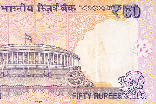 Indian 50 Rupee banknote featuring the iconic Sansad Bhavan (Parliament House) in New Delhi. Currency of India.