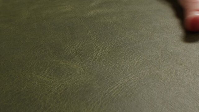 Genuine green leather texture, natural animal skin, luxury vintage cowhide background. Eco friendly leatherette, faux leather. Wallpapere, backdrop, copy space