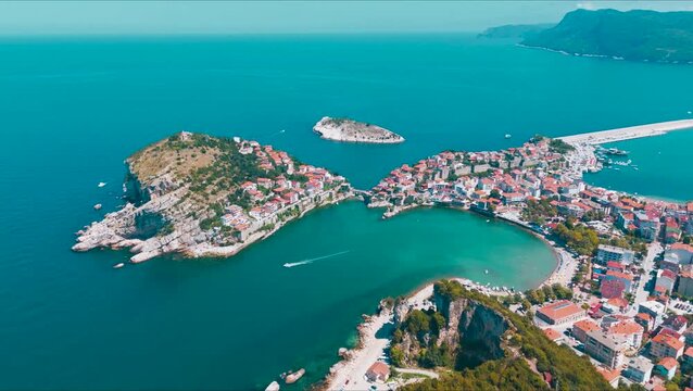 Cinematic 4K Aerial Wide Angle View of Amasra Peninsula, Bartin, Turkey. Historic Island Town with Red Roofs and Black Sea Coast, Panoramic View of Kemere Bridge and Roman Walls