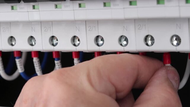 Disconnect electrical wires with metal tips from electrical modules with a screwdriver. 