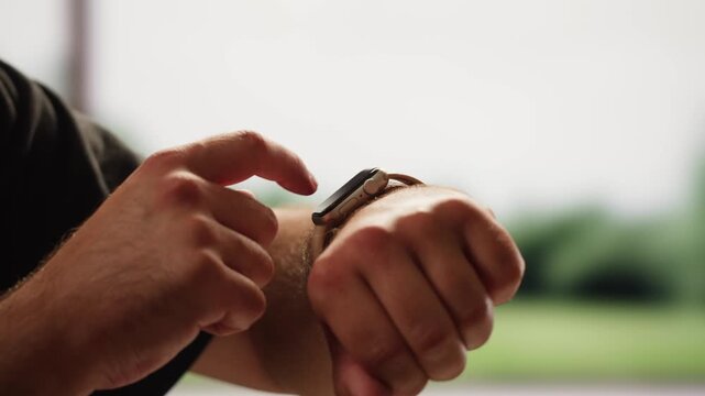 Smart watch using in gym, Close up of woman hands im gym checking incoming notification on smart watch. Incoming text message received on app smartwatch. Social media networking technology concept.