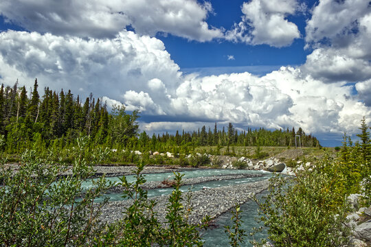 White clouds rolling everywhere - Kathleen river. . Kluane National Park, YT, Canada
