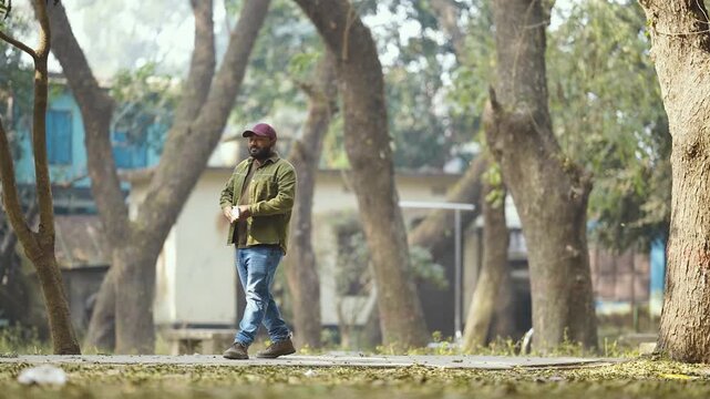 Man walking with smartphone, casual moment of a man walking while holding a smartphone, everyday lifestyle vibe, modern connection, natural light, candid feel, relatable and simple story