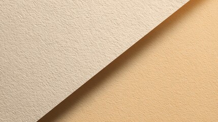 Fototapeta premium Textured beige and tan paper background with diagonal division