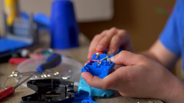 Led light on and off - Child's Hands Repairing Electronic Toy with Glowing LED, STEM Education and Technical Problem Solving, Hands-on Science Project and Maker Culture