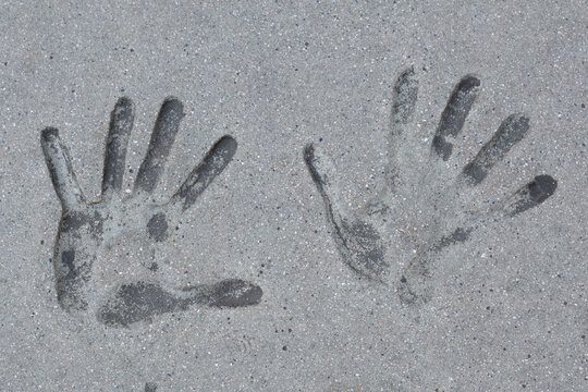 Handprints in Concrete Symbolizing Memory, Legacy and Human Imprint