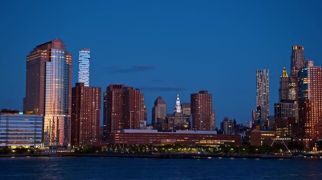 Residential and office buildings of Lower Manhattan at night. Close view of Lower Manhattan architecture including 56 Leonard Street building from the water.