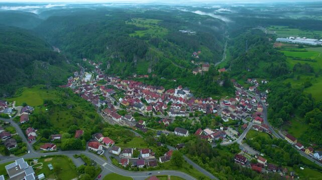 Aerial view of the city Pottenstein in Germany, Bavaria on a cloudy day in Spring
