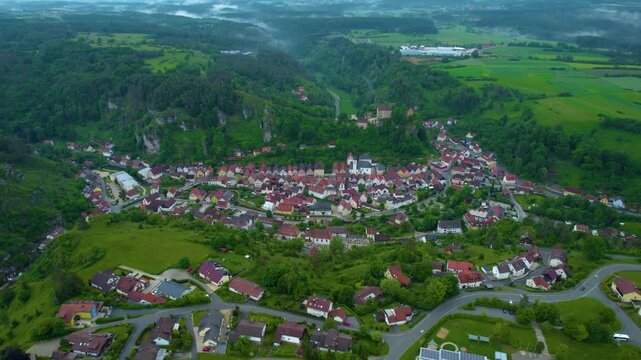 Aerial view of the city Pottenstein in Germany, Bavaria on a cloudy day in Spring