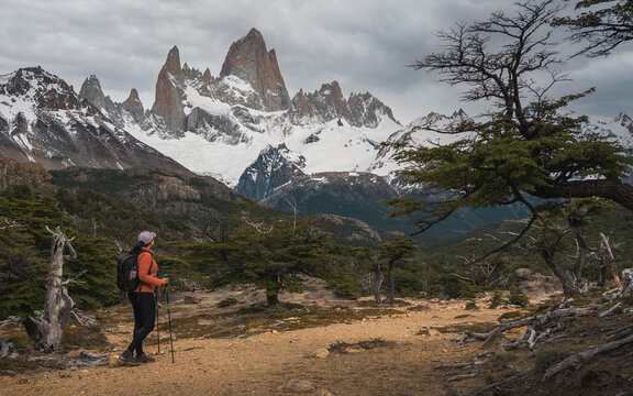 Woman hiker looking at Mount Fitz Roy peak in El Chalten Patagonia
